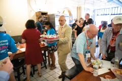 July 12, 2019: — Senator Hughes and colleagues served up food, coffee and drinks to customers during the busy happy hour at El Fuego restaurant in support of the federal Raise the Wage Act nationwide and One Fair Wage in the state.